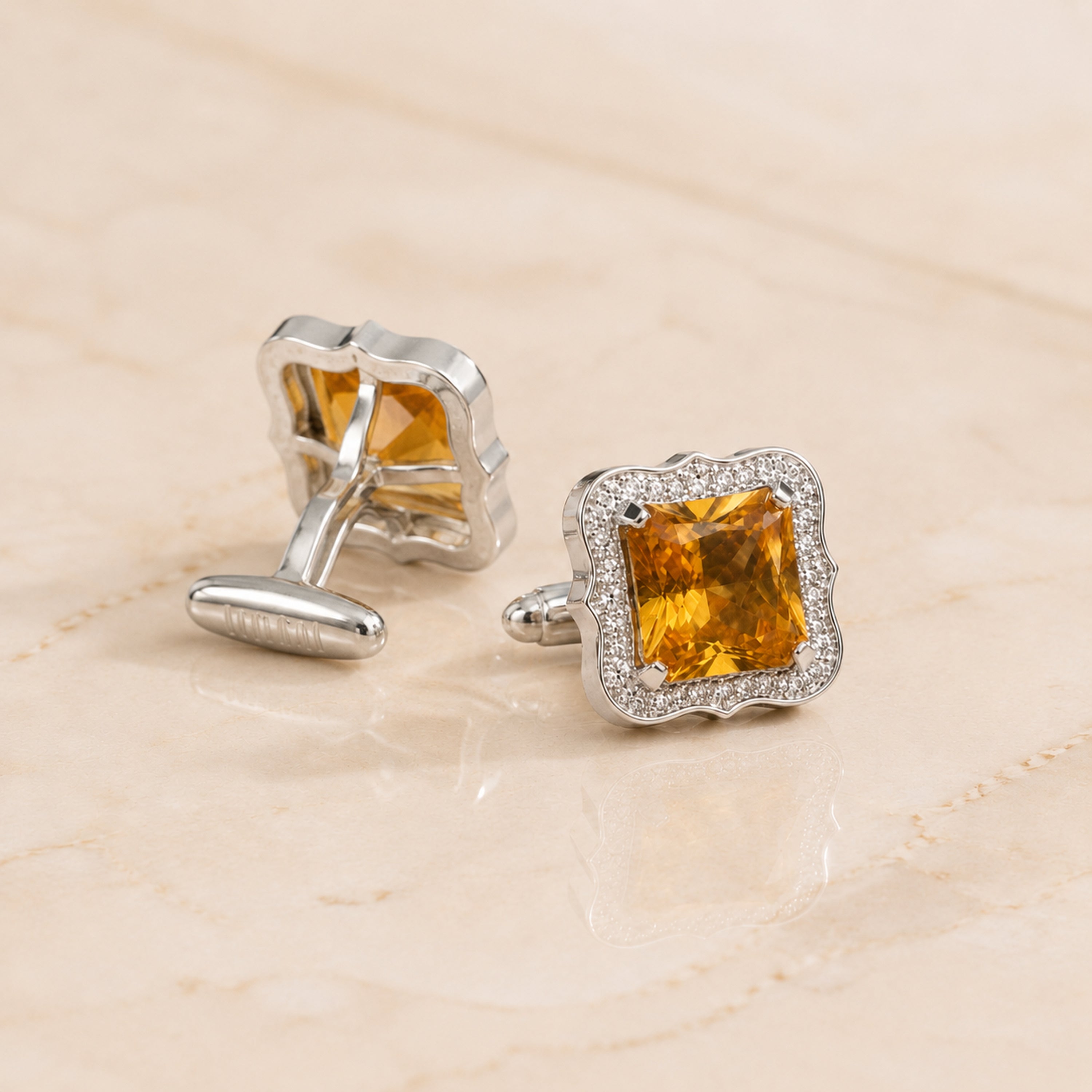 Square cufflink shown from the front with polished silver tone frame