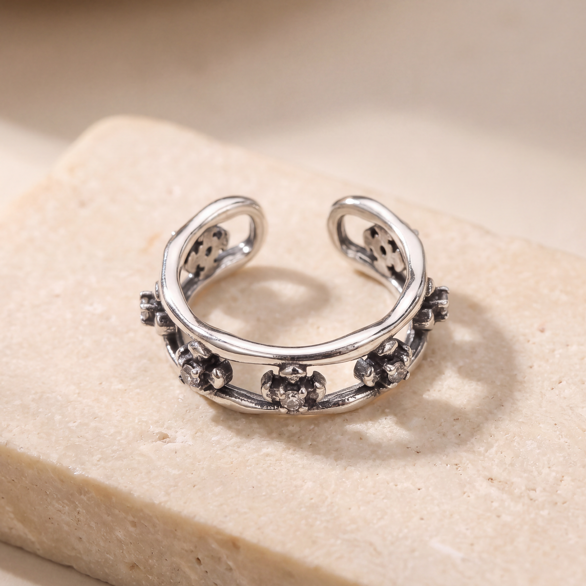 Close view of the Wildflower Ear Cuff showing the oxidised petal detail