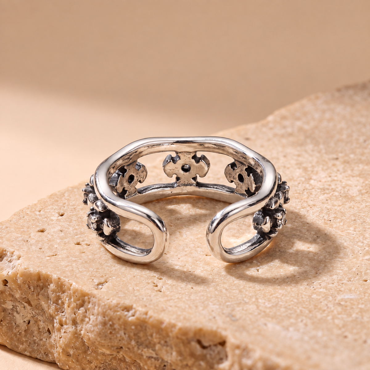 Wildflower dainty flower ear cuff in oxidised sterling silver, angled view
