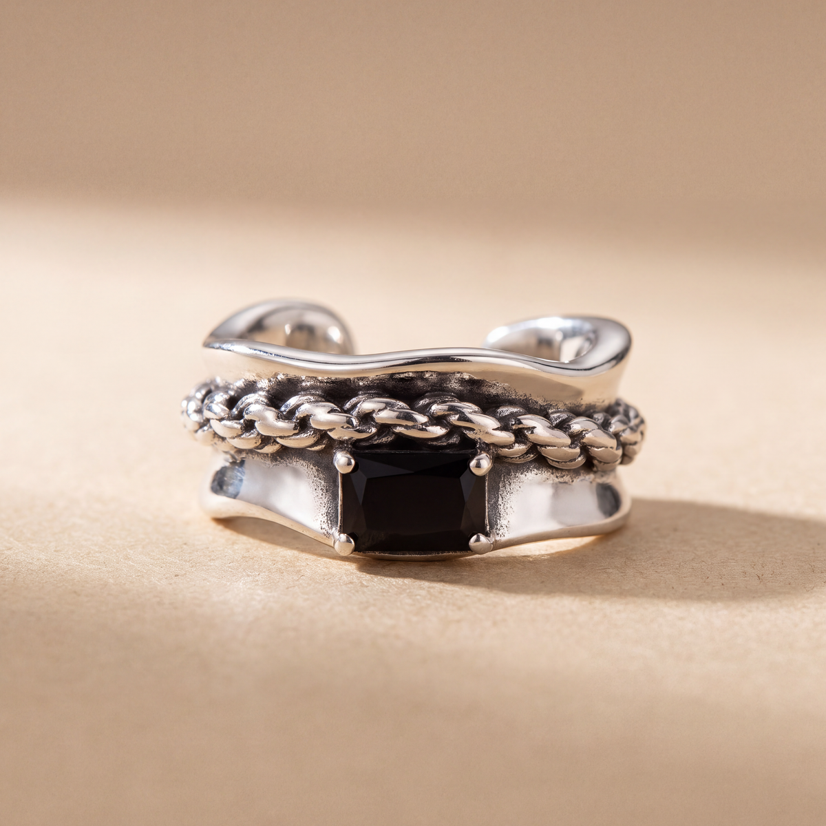 Corsair Ear Cuff in oxidised 925 sterling silver with a twisted rope edge and emerald-cut black cubic zirconia, no piercing needed - Kavati