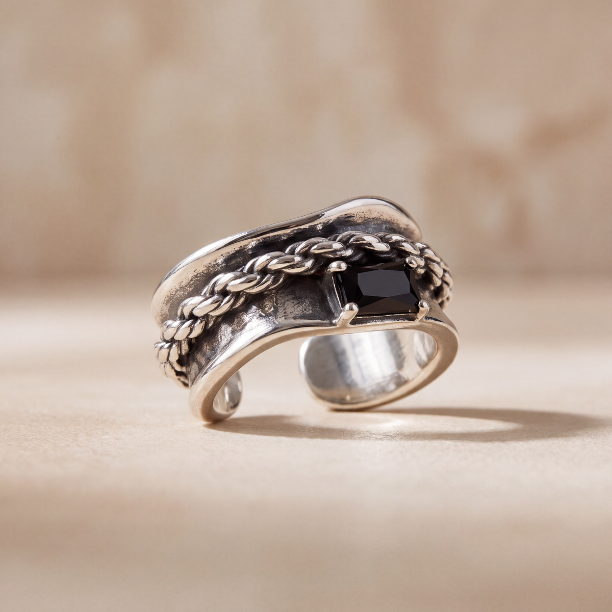 Corsair rope twist ear cuff in oxidised sterling silver, angled view