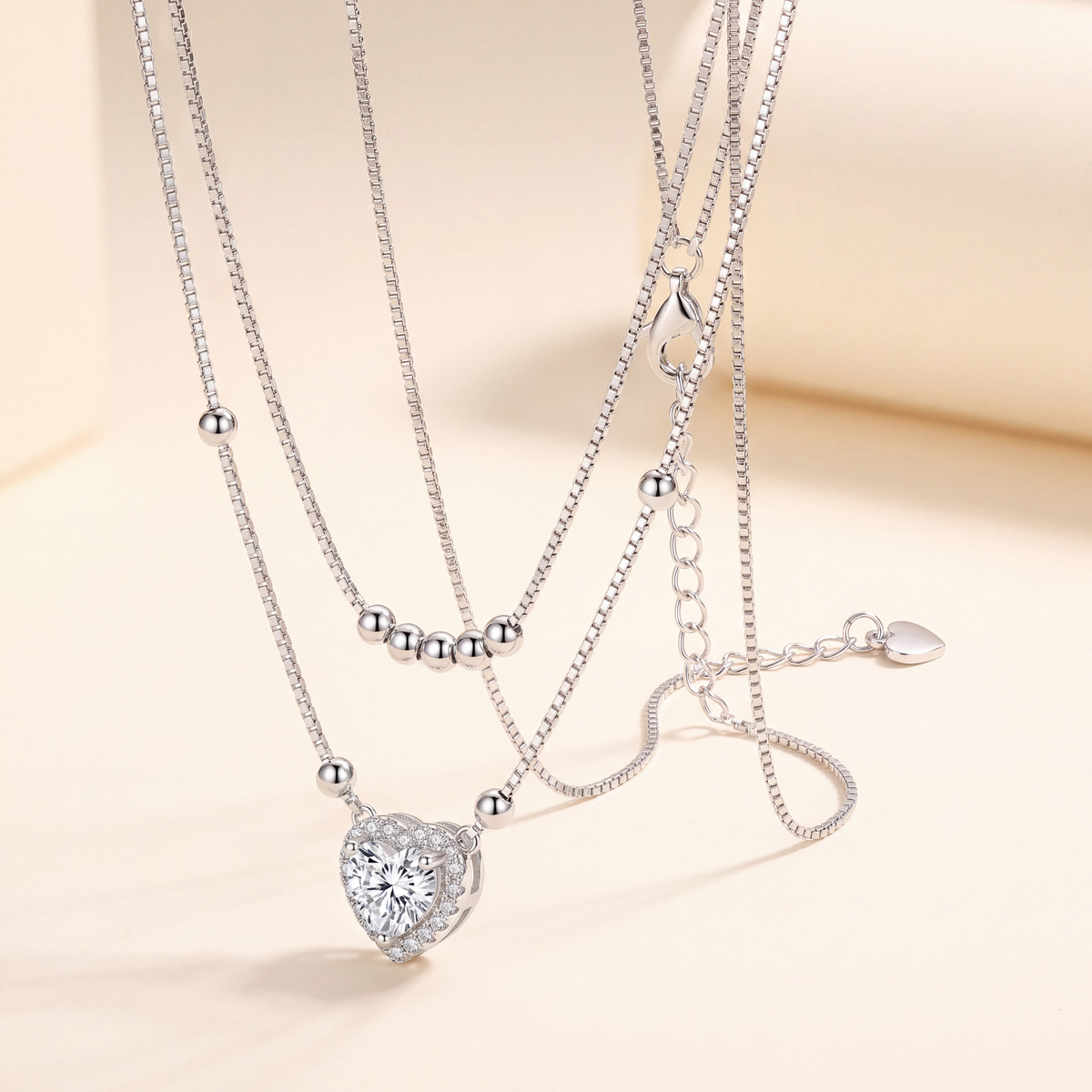 Close up of the lobster clasp, 5 cm extender chain and 925 stamped heart tag on the Juliet moissanite necklace