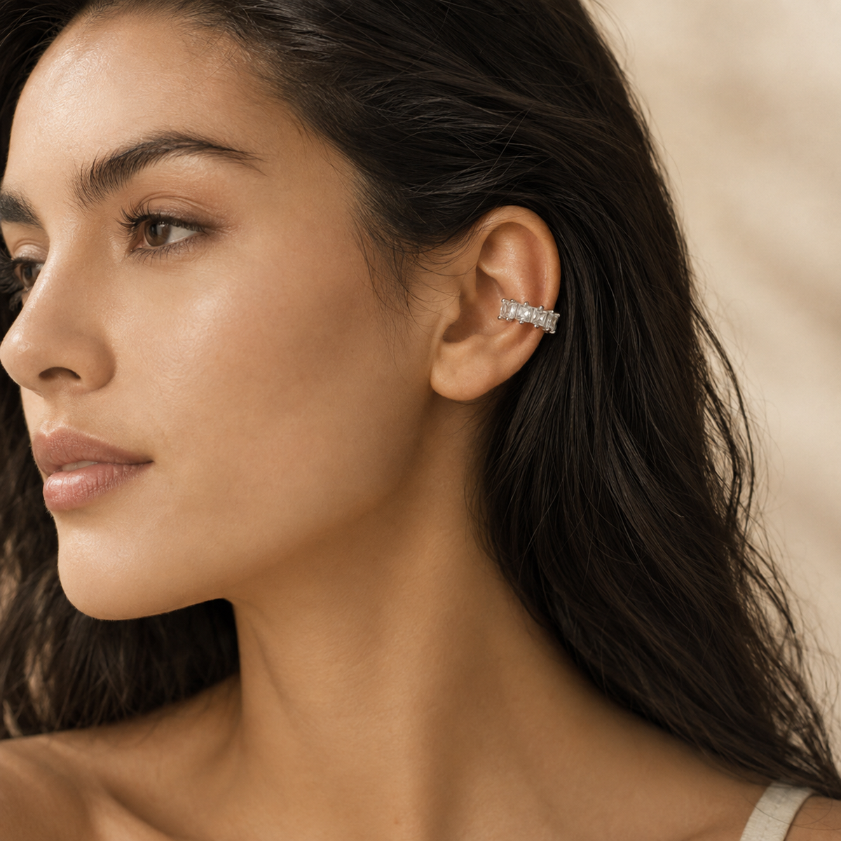 Candy Cube clear ear cuff worn on the ear, close-up