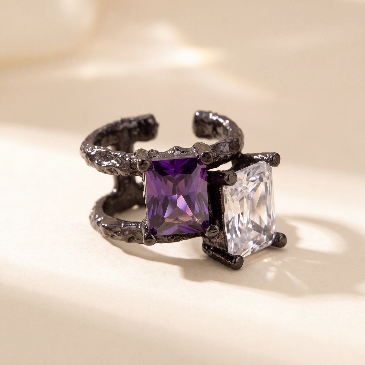Molten Frame Ear Cuff, black tone, close view of the molten frame and stones