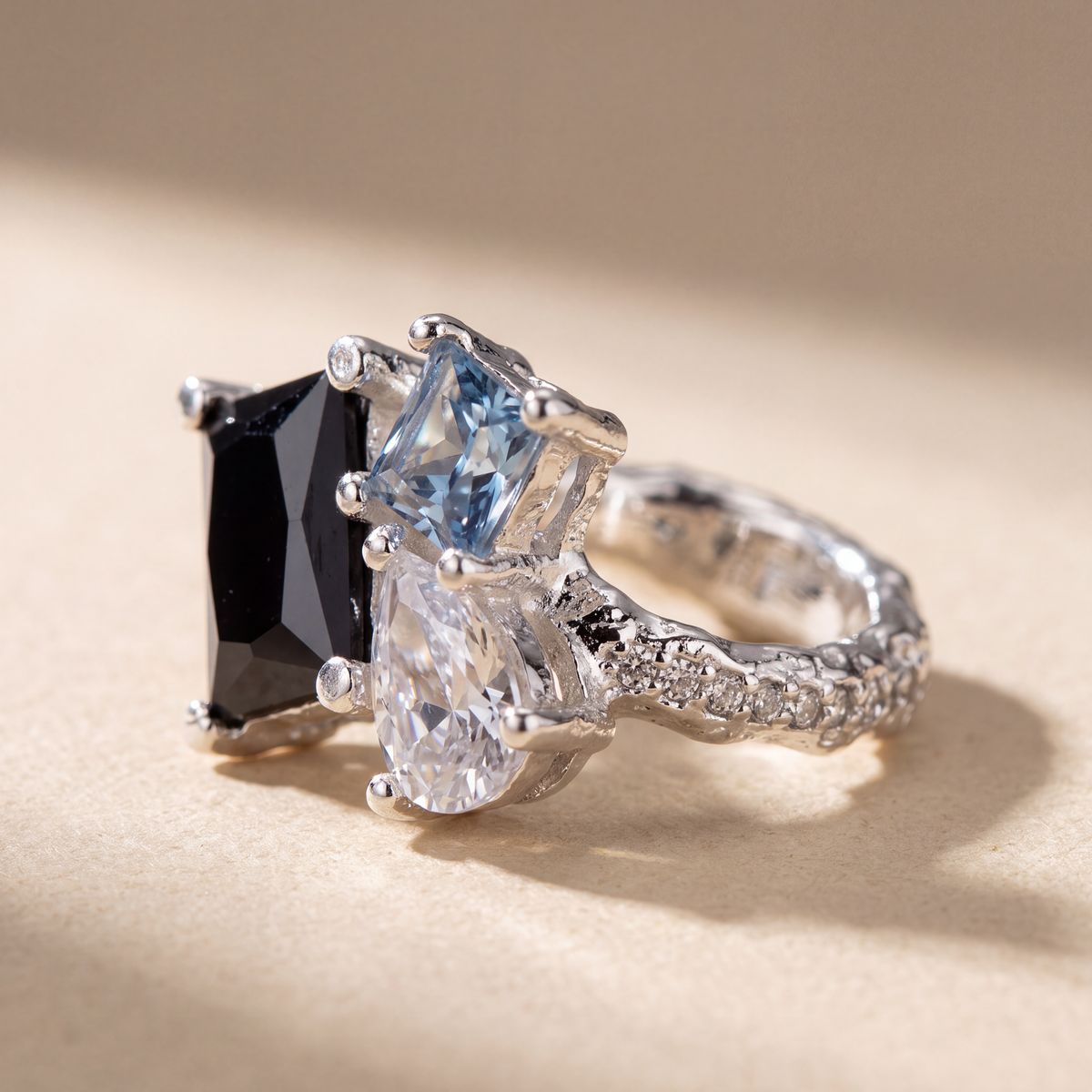 Dewdrop Ear Cuff in polished sterling silver with a blue pear-cut stone, no piercing needed - Kavati