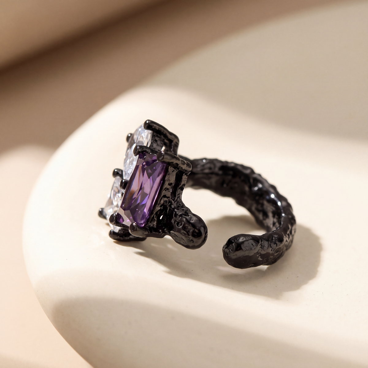 Dewdrop Ear Cuff in blackened sterling silver with a purple pear-cut stone, no piercing needed - Kavati