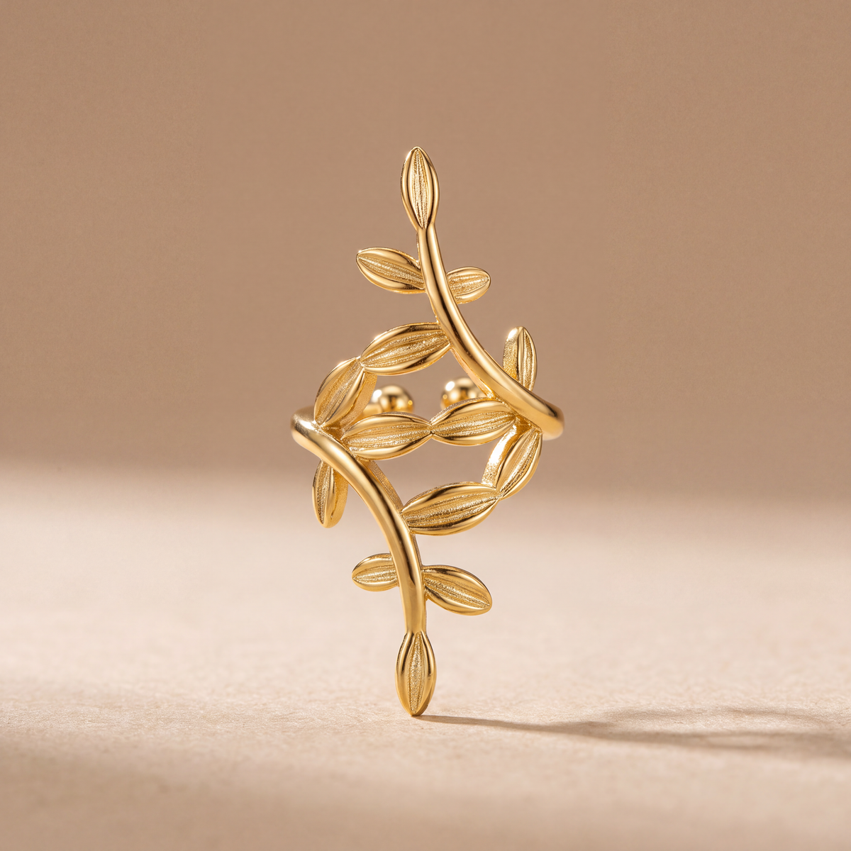 Laurel Vine gold leaf ear cuff, front view showing the intertwined sprigs