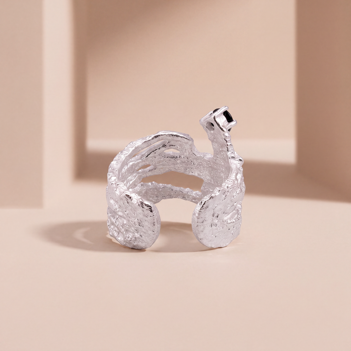 Meteorite textured silver ear cuff, angled view
