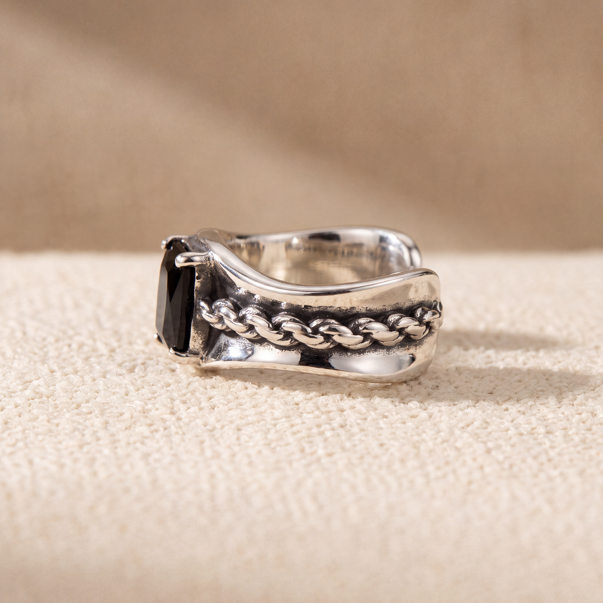 Close view of the Corsair Ear Cuff showing the twisted rope detail and black cubic zirconia in a four-claw setting