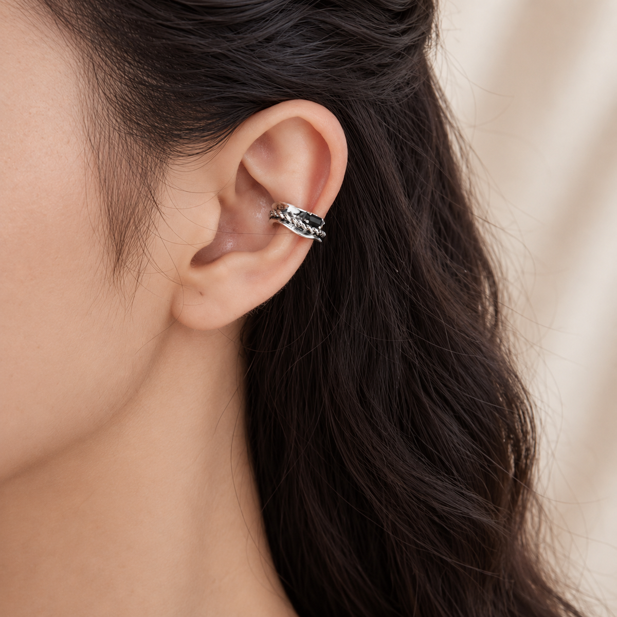 Corsair Ear Cuff in oxidised sterling silver with rope detail and black cubic zirconia, angled close view