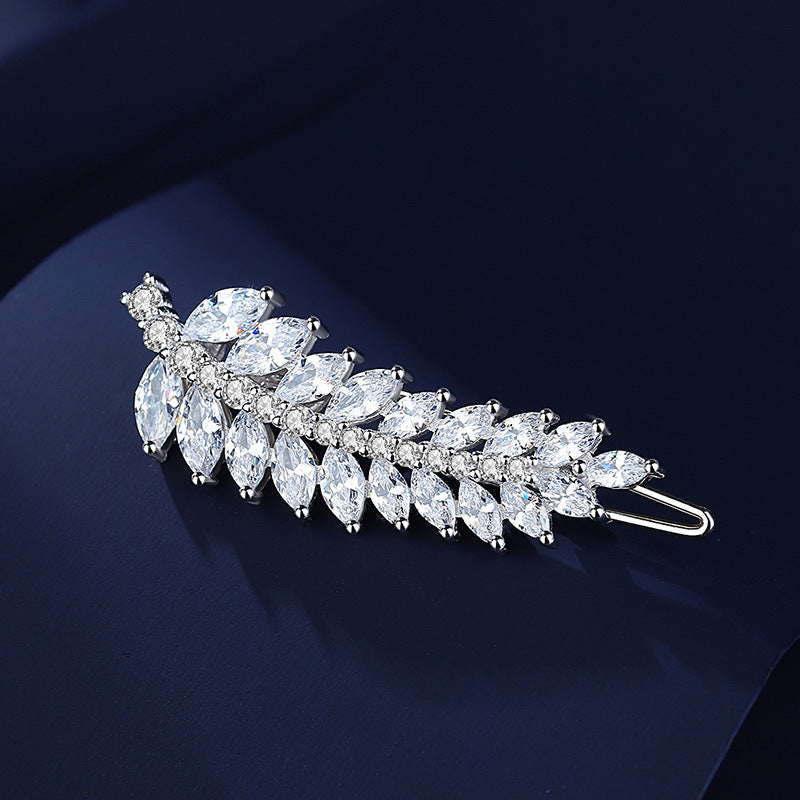 Rhodium plated silver leaf hair pin shown from the side